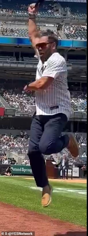 Johnny Damon jumps in the air during Old Timers' Day