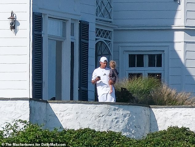 The Chiefs star quarterback was later spotted holding his little one in the sun