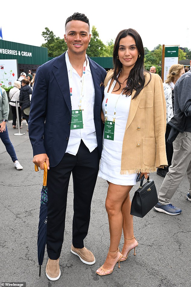 He was called about the sacking while on holiday with his model wife Ellie Penfold (pictured with Jenas at Wimbledon in July) and their three children