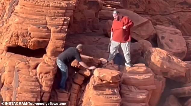 The men were reportedly captured on camera working hard to push the ancient rock formation off the edge of a cliff