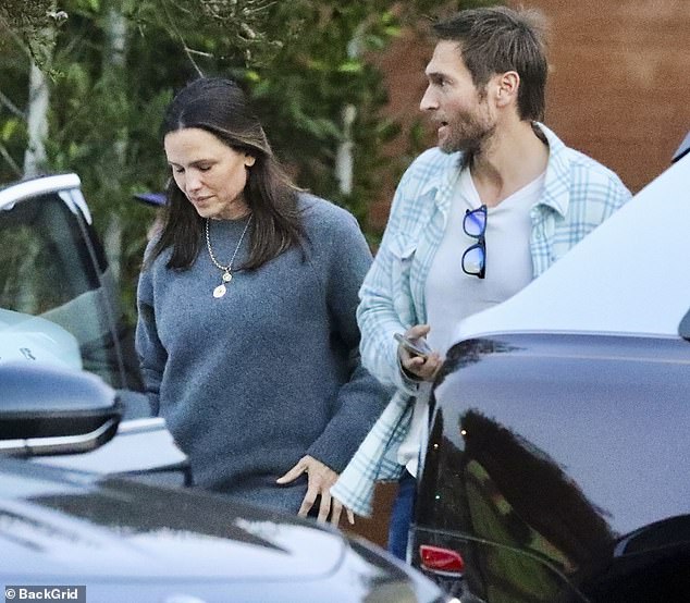 The 52-year-old actress wore an oversized gray sweater in Malibu's unusually cool temperatures