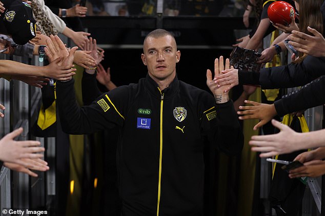 'Dusty' leaves the game as one of modern football's legends - and every Richmond fan at the MCG wanted a piece of him