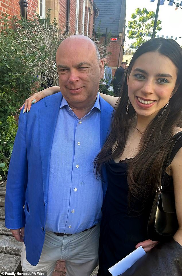 Mr Lynch is pictured with his daughter Hannah, who also died on the ship