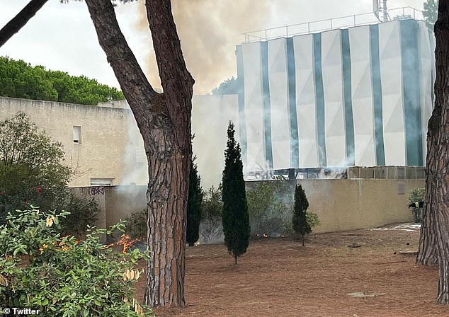 Firefighters, police and the Gendermerie arrived at the scene of the Beth Yaacov synagogue in La Grande-Motte at around 8:40 a.m. local time (pictured: smoke rising into the air)