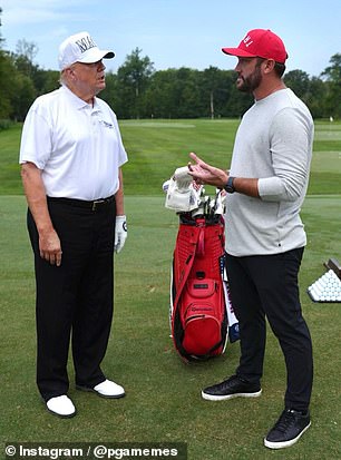 Miller wore a red hat with Trump upside down on it