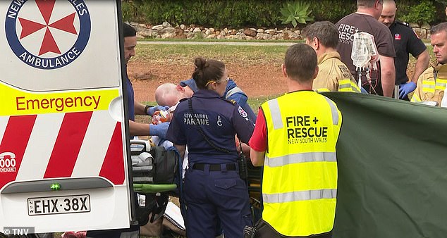 In the photo: Emergency services treat an injured person at the scene