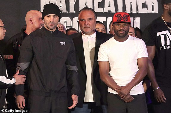 MEXICO CITY, MEXICO - AUGUST 23: John Gotti III (L) and Floyd Mayweather Jr. face off during the weigh-in prior to their exhibition bout at the Big Bola Casino on August 23, 2024 in Mexico City, Mexico. (Photo by Medios y Media/Getty Images)