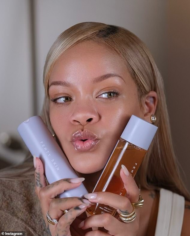 In a cute photo, she posed with her peach tea-colored toner and sunscreen, holding them up to her face while puckering her lips