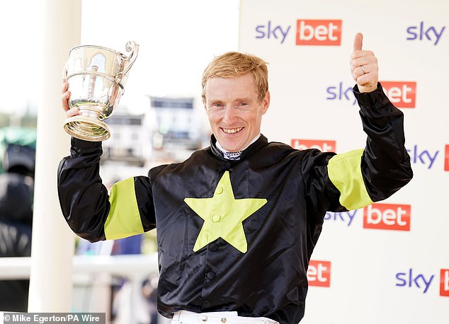 Winning jockey William Lee celebrates his victory with Magical Zoe in York