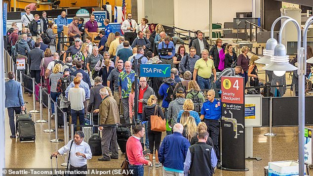 Hundreds of travelers were stranded at Seattle-Tacoma International Airport on Saturday afternoon due to flight delays and cancellations over possible cyberattacks.