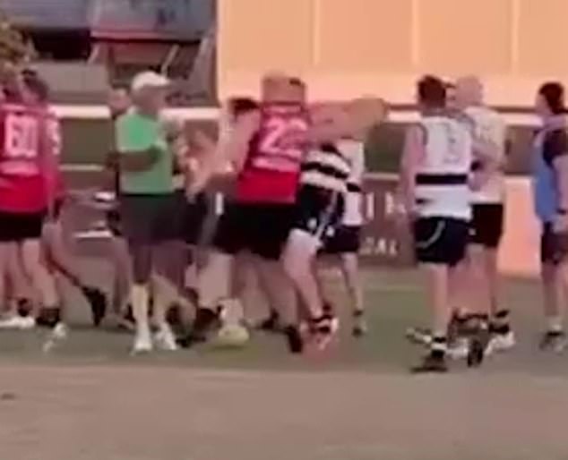 Video footage showed the player in the red 22 shirt allegedly striking Cloke's head with his elbow (pictured) as a brawl broke up