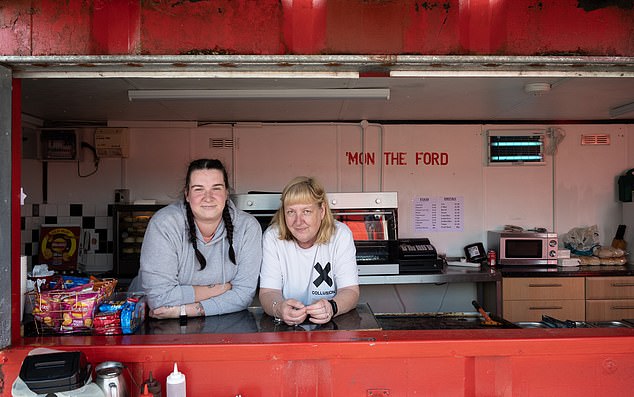 Danielle (left) and Roberta enjoy a moment of calm before the storm at Blair Park's cake stall