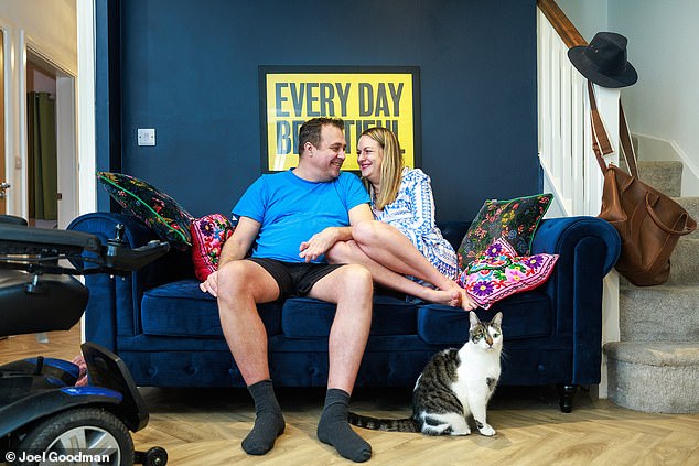 Erica Crompton at home with her partner Paul, who has helped her feel comfortable in her own body.