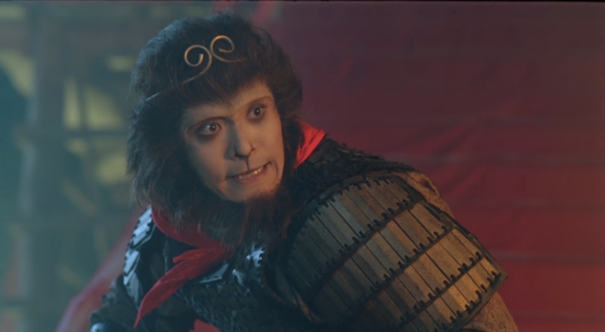 A humanoid ape looks into the camera, dressed in armor and a red handkerchief in A Chinese Odyssey Part Two: Cinderella