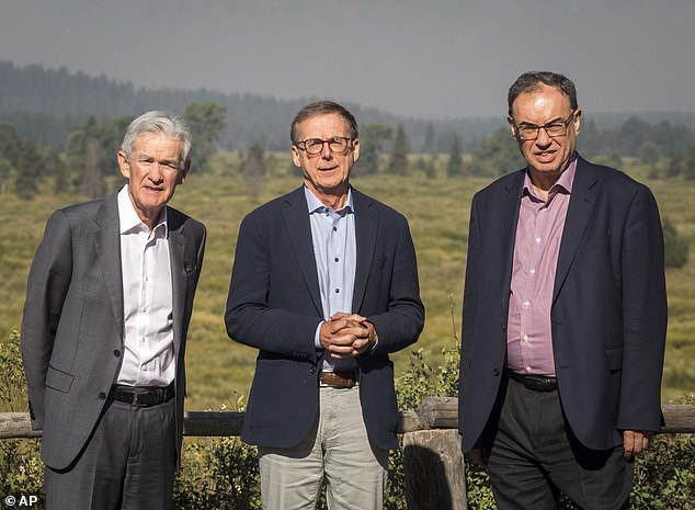 Federal Reserve Chairman Jerome Powell (left), Bank of Canada Governor Tiff Macklem (center) and Bank of England Governor Andrew Bailey pose for a photo during the Fed's annual meeting in Jackson Hole on August 23, 2024. During the meeting, Powell indicated that a policy shift is coming