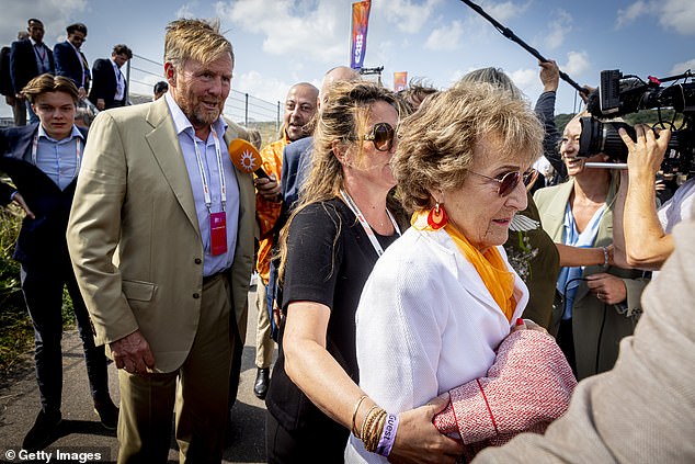 Princess Margriet of the Netherlands was guided through the paddock by King Willem-Alexander