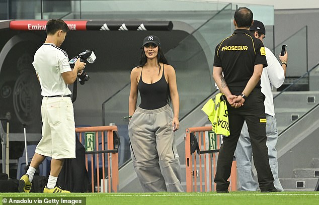 After the match, the mother of four pulled some strings and son Saint was seen playing a game of football on the pitch with Real Madrid star Vinicius Junior