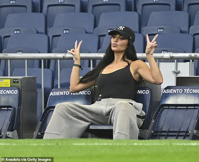 She pouted for the camera and held up two peace signs as she spent time in the empty stadium