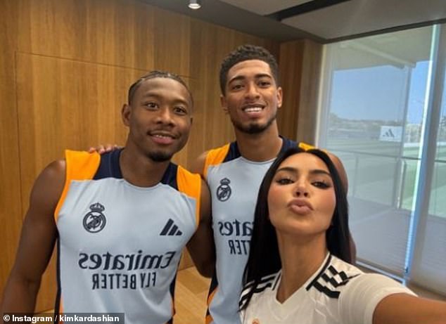 The influencer put her famous selfie skills to use and snapped this photo with players David Alaba (left) and Jude Bellingham (right)