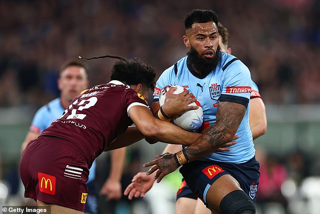 Payne Haas (pictured with the ball for NSW in the second match of this year's State of Origin series) has continued to play his football despite the serious allegations facing his mother