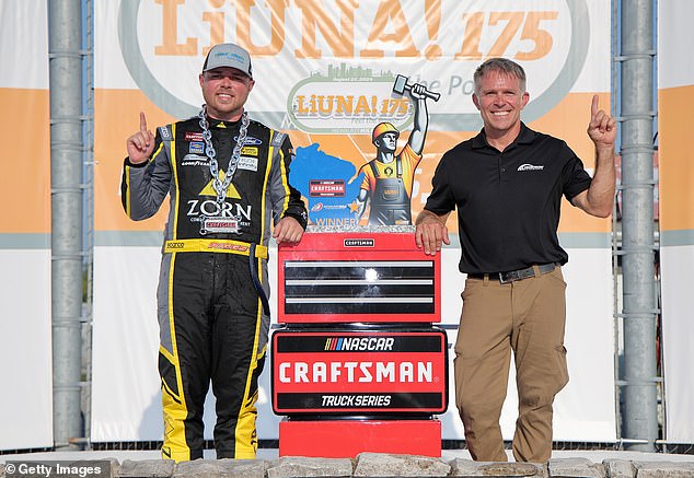 Riggs, driver of the #38 Zorn Compressor & Equipment Ford, celebrates with his father, former NASCAR driver Scott Riggs