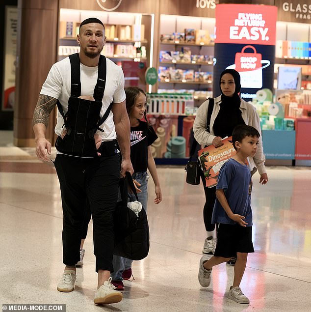 Williams, who recently became a father for the fifth time, was photographed with his family at Sydney airport on Sunday