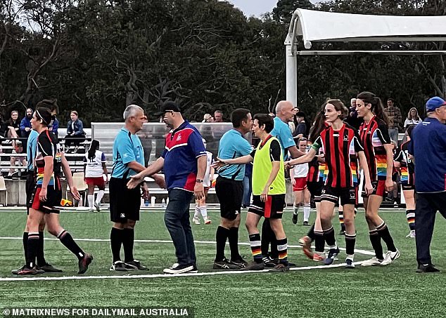 Players from West Pennant Hills Cherrybrook Football Club and Flying Bats shake hands after the grand final