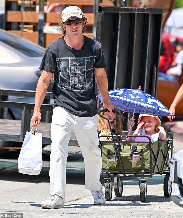 The 33-year-old actor wore a King Of New York T-shirt featuring an image of Christopher Walken, teamed with gray pants and matching white sneakers