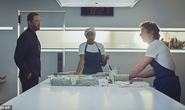 Ebon Moss-Bachrach, Ayo Edebiri and Jeremy Allen White appear in a scene from The Bear