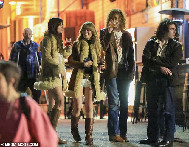 Mia donned a fur-lined coat and enjoyed a few drinks as she mingled with friends who came to support her