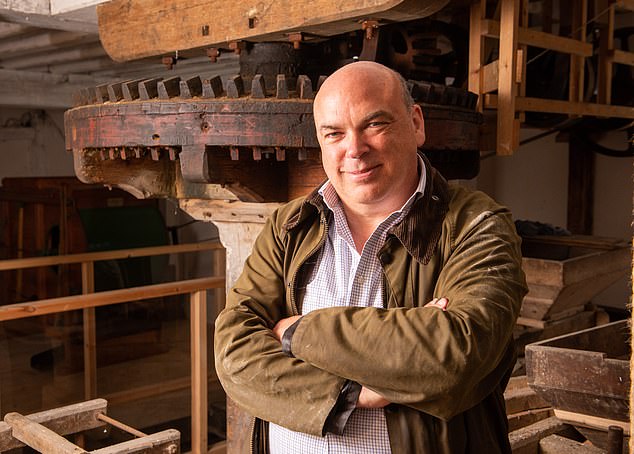 Tech entrepreneur Lynch with his renovated mill on his Suffolk farm