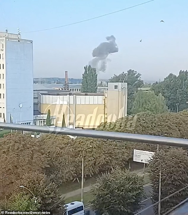 Smoke rises above a building in western Ukraine during one of Russia's airstrikes on the country since the war began