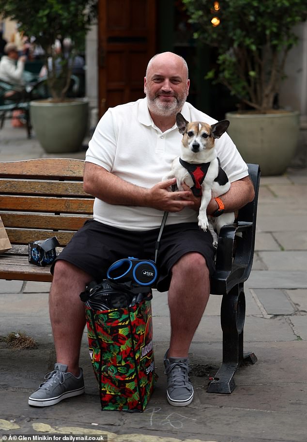 Graeme Gallagher, 44, who visited York with his Jack Russell/Chihuahua cross dog Ziggy, said the pride flag 'really doesn't bother me'