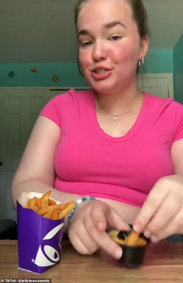 Jenna is pictured eating Taco Bell while talking to her camera and engaging with her followers