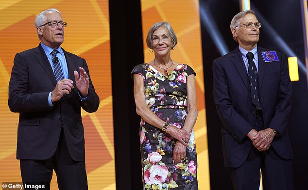 Walton (center) sits behind her brothers — Rob (left) and Jim (right) — on the billionaire list, with each sibling owning nearly 12 percent of Walmart