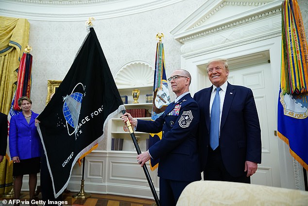 Trump created Space Force in December 2019 to form the first new branch of the military since 1947, when the Air Force became its own entity. He unveils the flag in the Oval Office in 2020