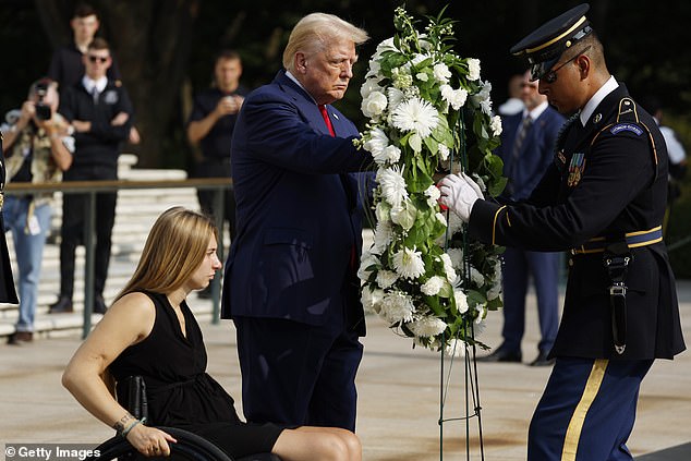 Donald Trump lays a wreath next to Marine Cpl. Kelsee Lainhart (Ret.), who was injured in the Abbey Gate bombing