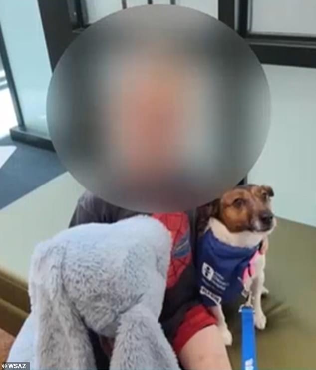 The six-year-old victim, pictured here with another dog, was bitten in the neck and ear and taken to hospital but is expected to recover