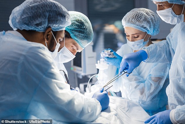 File photo of a surgical team operating on a patient. The new wafer is expected to provide 24-hour relief for up to a month after surgery