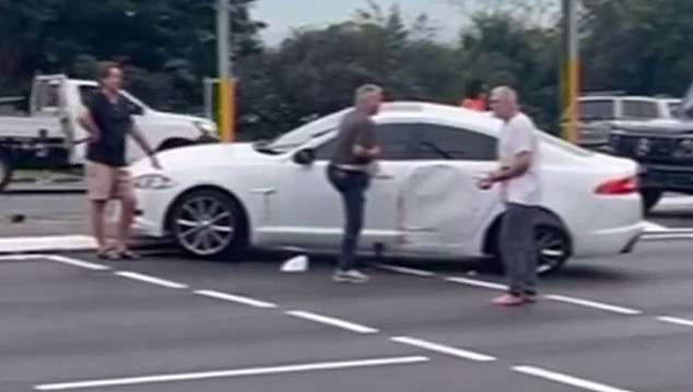 Steve Mace (far left) was one of the witnesses who stopped the alleged attacker (right) from getting into the car, which contained the man's partner with serious injuries