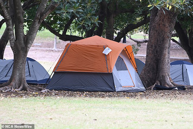 Mark from Hobart wants to help people - the tent he rents in his backyard for $125 a week includes all bills except food (pictured are homeless people camping in a city park)