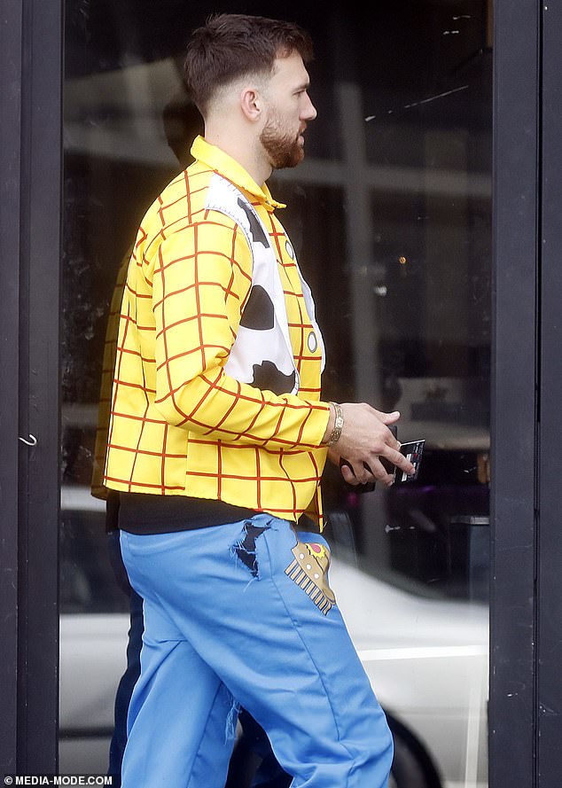 Richmond players en route to the Rising Sun Hotel in Melbourne (pictured is defender Noah Balta)