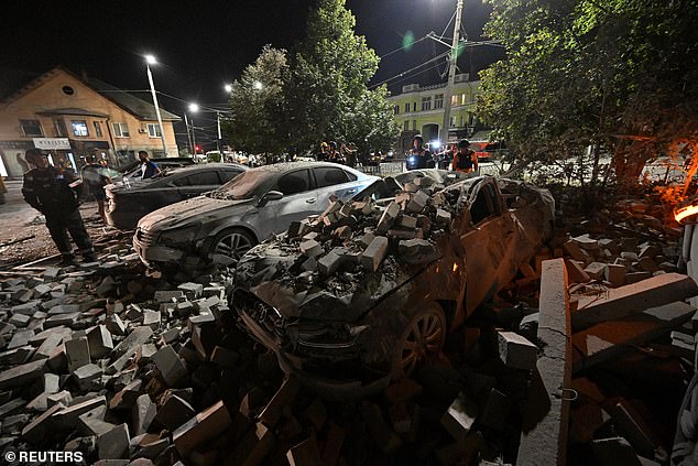 A car crushed by rubble from a destroyed building in Kryvyi Rih, central Ukraine