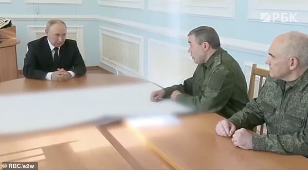 A visibly angry Putin is seen in a muffled video of a weekend meeting with top military leaders