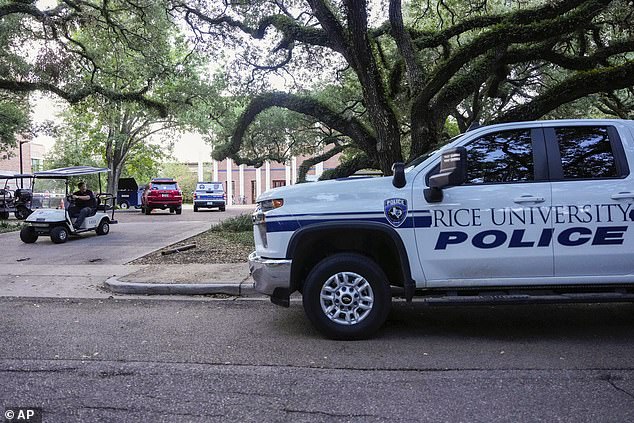 A Rice University police vehicle is parked after the alleged murder-suicide at Jones College