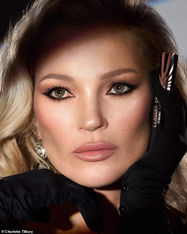 The supermodel, who turned 50 in January, wore thick black eyeliner as she stared into the mirror