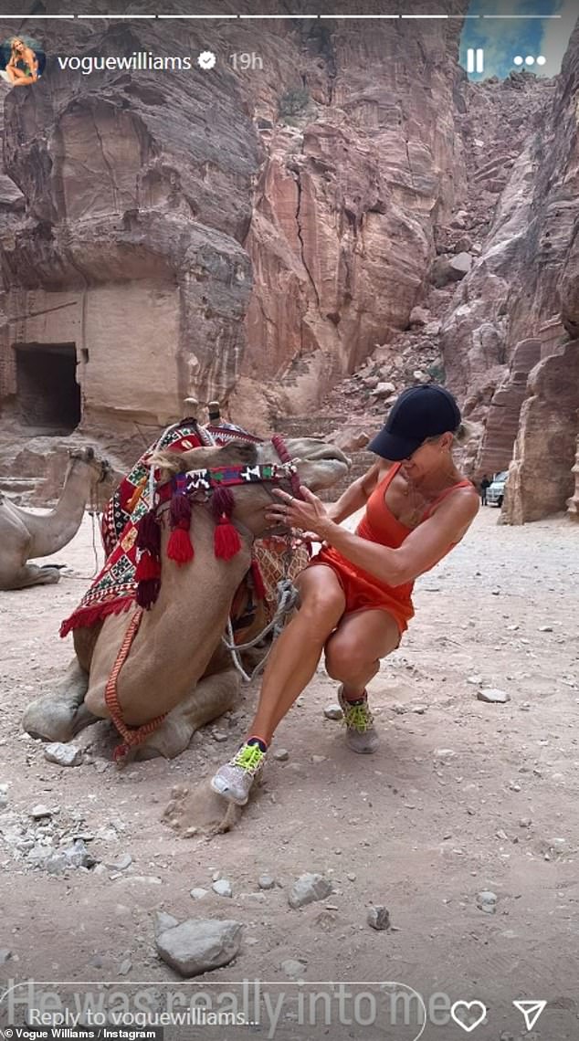 The camel decided to cuddle her face, which made Vogue recoil in surprise. She joked: 'He was really interested in me'