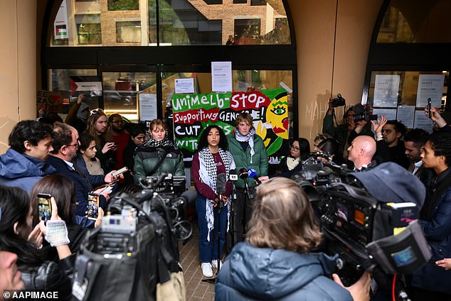 Pictured: University of Melbourne students speak at a press conference during a pro-Palestine protest