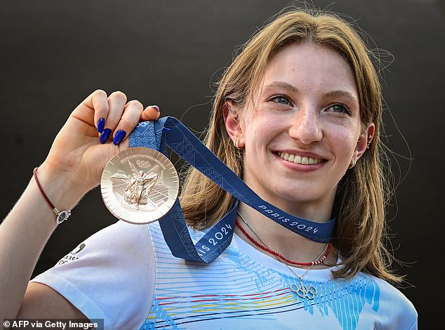 Romanian gymnast Ana Maria Barbosu poses with her bronze medal at the Olympic Games