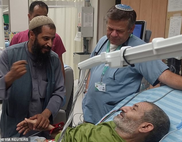 Qaid Farhan Alkadi, a Bedouin Israeli hostage who was abducted in the deadly Hamas attack on October 7, is greeted by a loved one after being rescued by Israeli forces at the Soroka Medical Center in Beersheba, Israel